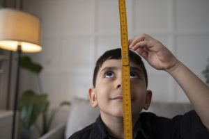Young boy measuring height